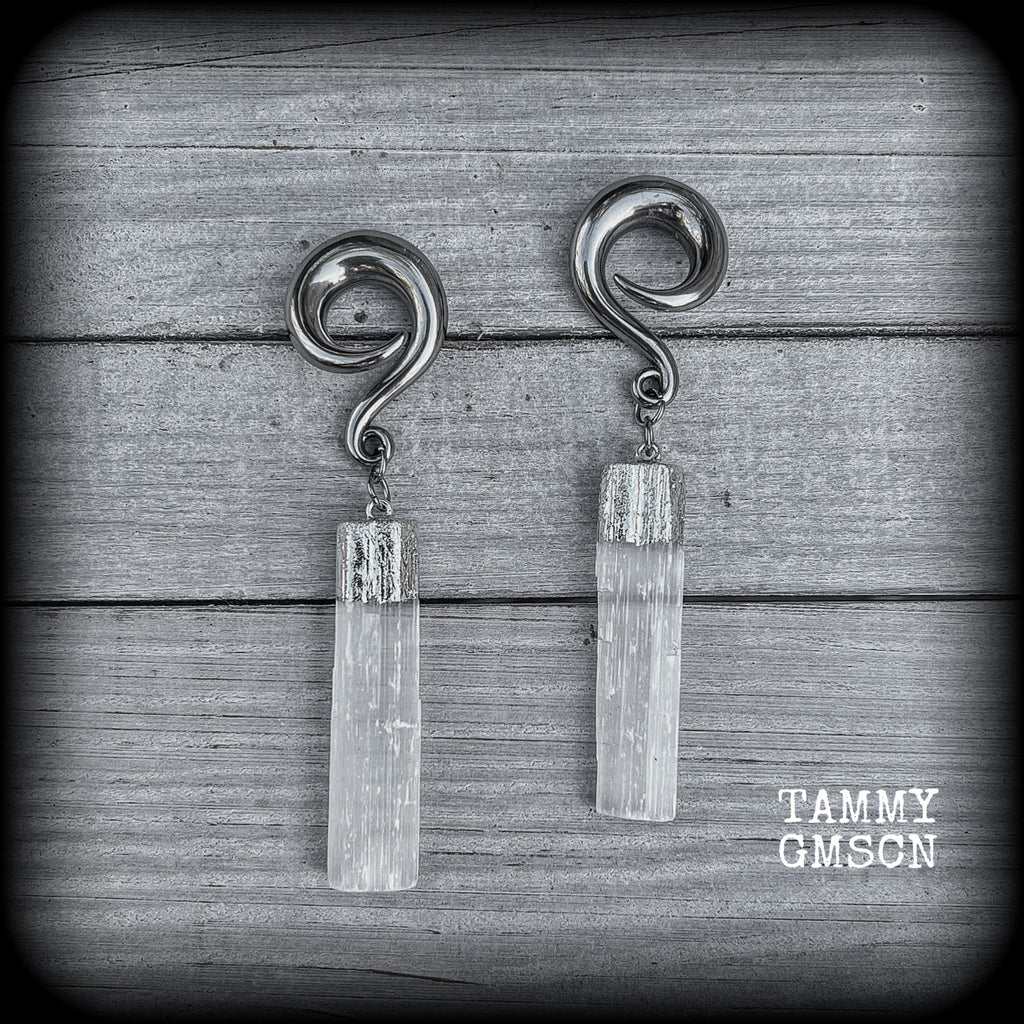 These beautiful gauged earrings feature gorgeous selenite pieces, measuring just over 9cms from tip to tip, and weighing approx 22 grams each.

This pair have been made on 0 gauge (8mm) surgical steel full curl hooks, to be worn in stretched lobes.

