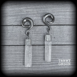 These beautiful gauged earrings feature gorgeous selenite pieces, measuring just over 9cms from tip to tip, and weighing approx 22 grams each.

This pair have been made on 0 gauge (8mm) surgical steel full curl hooks, to be worn in stretched lobes.

