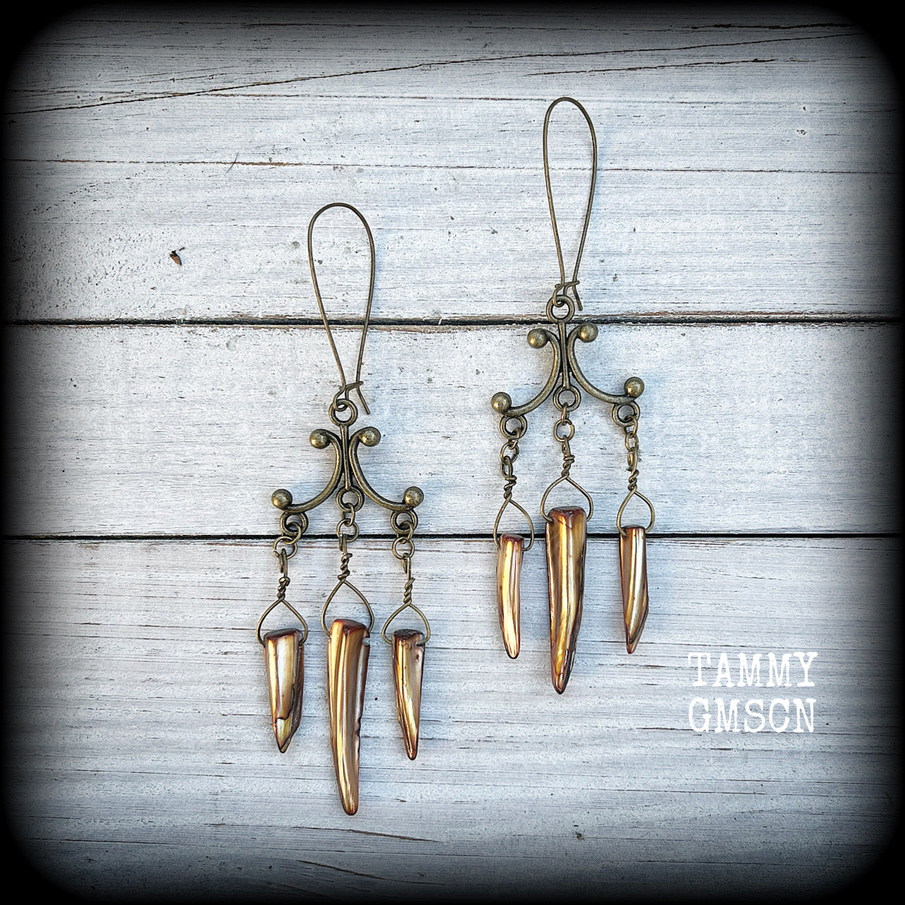 Antique bronze and shell tusk earrings