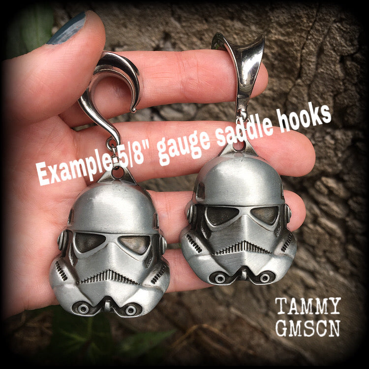 Measuring approx 8cms from tip to tip, these Storm Trooper ear hangers are nice and big, and nice and dangly, weighing around 26 grams each.

This pair has been made on 5/8" gauge (16mm) surgical steel saddles, suitable for stretched lobes.