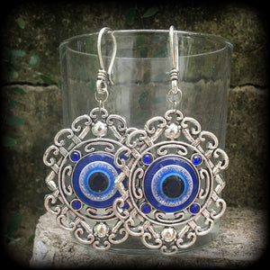 Evil eye earrings-Esoteric tunnel earrings