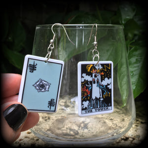 This pair of earrings features a classic Rider Waite ‘The Tower’ acrylic tarot card, measuring just over 6cms from tip to tip, and weighing only a gram or two each.

This pair has been made with stainless steel french hooks, for pierced ears.