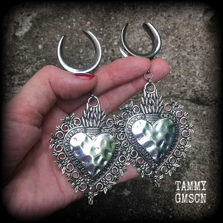These gorgeous antique silver gauged earrings feature big beautiful sacred hearts, measuring 11cms from tip to tip, and weighing approx 21 grams each.

This pair has been made on 1" gauge (25mm) surgical steel cradles, to be worn in stretched lobes.