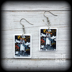 This pair of earrings features a classic Rider Waite ‘The Tower’ acrylic tarot card, measuring just over 6cms from tip to tip, and weighing only a gram or two each.

This pair has been made with stainless steel french hooks, for pierced ears.