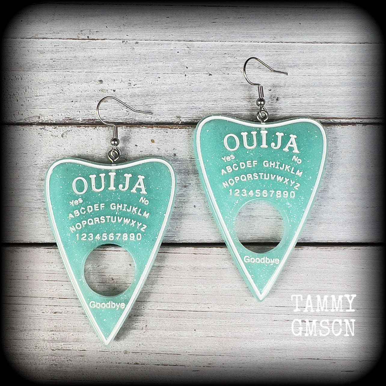 These gorgeous oversize baby blue pastel goth planchette earrings are big and dangly!!!
Weighing in at 8 grams each and measuring just under 8 cms from tip to tip.

This pair of earrings have been made on stainless steel french hooks, suitable for pierced ears.