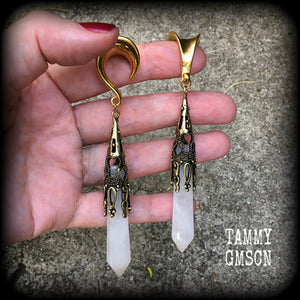 These gorgeous gothic gemstone gauged earrings feature beautiful cloudy quartz and antique bronze gemstone points, measuring just over 10 cms from tip to tip, and weighing approx 15 grams each.
These earrings have been made on 5/8" gauge (16mm) surgical steel saddles, to be worn in stretched lobes.
