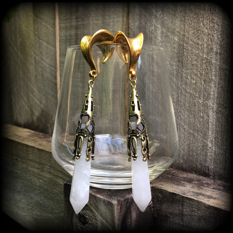 These gorgeous gothic gemstone gauged earrings feature beautiful cloudy quartz and antique bronze gemstone points, measuring just over 10 cms from tip to tip, and weighing approx 15 grams each.
These earrings have been made on 5/8" gauge (16mm) surgical steel saddles, to be worn in stretched lobes.