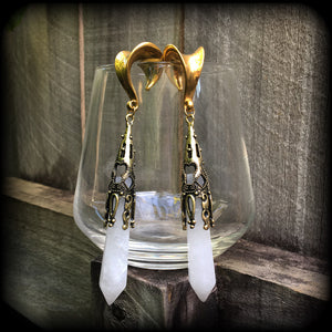 These gorgeous gothic gemstone gauged earrings feature beautiful cloudy quartz and antique bronze gemstone points, measuring just over 10 cms from tip to tip, and weighing approx 15 grams each.
These earrings have been made on 5/8" gauge (16mm) surgical steel saddles, to be worn in stretched lobes.