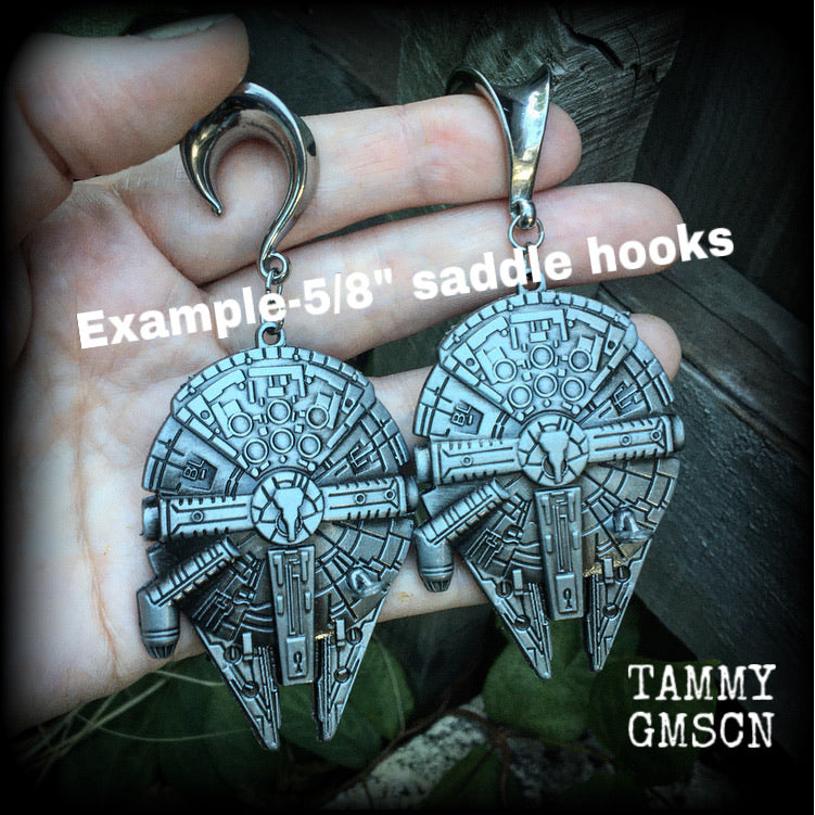 These Star Wars Millennium Falcon ear hangers are nice and heavy at 41 grams a piece, and nice and dangly at 10cms from tip to tip, these are BIG!!!!

This pair has been made on 5/8" gauge (16mm) surgical steel saddles, suitable for stretched lobes.
