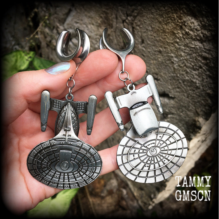 These awesome Star Trek USS Enterprise ear hangers feature a gorgeous big pewter Enterprise pendant, measuring just over 9cms from tip to tip, and weighing approx 37 grams each, nice and heavy.

This pair has been made on 5/8" gauge (16mm) surgical steel cradles, to be worn in stretched lobes.
