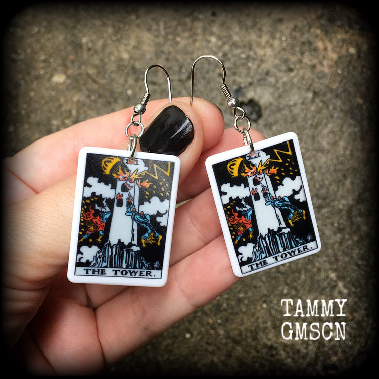This pair of earrings features a classic Rider Waite ‘The Tower’ acrylic tarot card, measuring just over 6cms from tip to tip, and weighing only a gram or two each.

This pair has been made with stainless steel french hooks, for pierced ears.