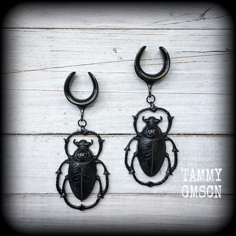 These gorgeous black enamel 'Scarab beetle' gauged earrings measure approx 9cms from tip to tip, and weigh approx. 16 grams a piece, not too heavy.
This pair has been made on 3/4" gauge (19mm) gauge surgical steel cradles, to be worn in stretched lobes.