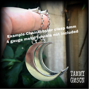 Crescent moon tunnel earrings