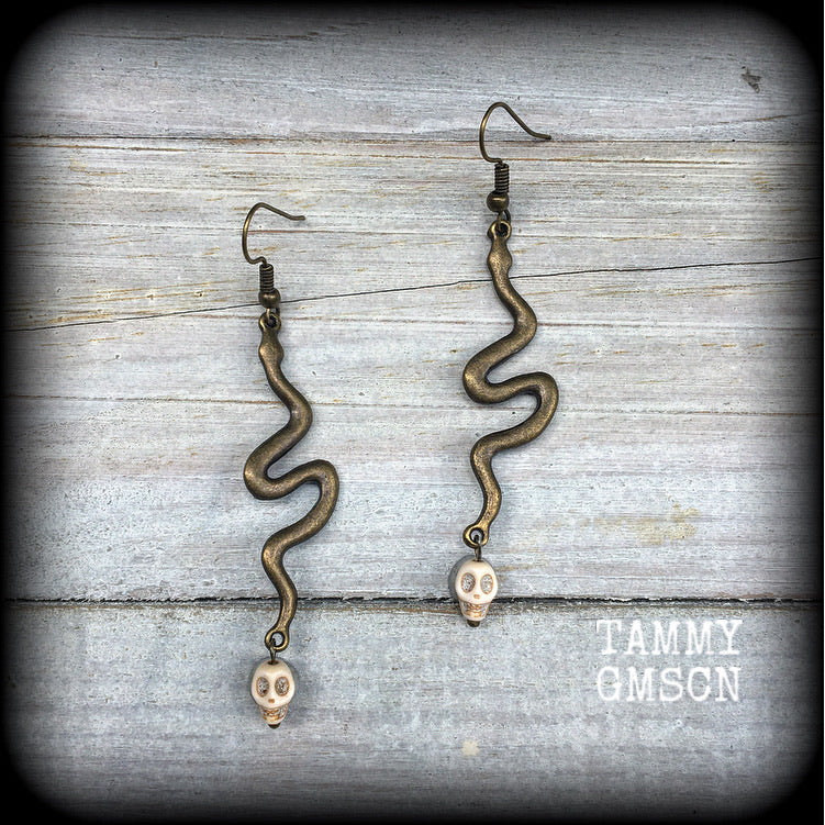 Bronze snake and stone skull earrings