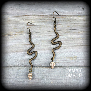 Bronze snake and stone skull earrings