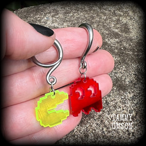 These super rad earrings feature classic acrylic pixelated Pac man and Blinky charms, measuring 5 cms from tip to tip, weighing in at only 4 grams each.
This pair has been made on 6 gauge (4mm) surgical steel full curl hooks, suitable for stretched lobes.