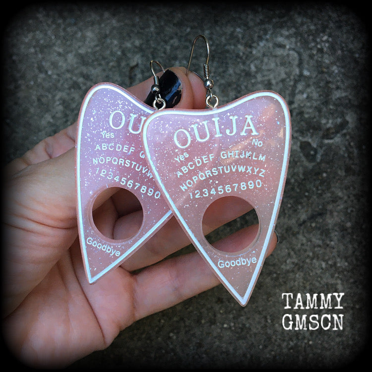 These gorgeous oversize pastel goth acrylic planchette earrings are big and dangly, weighing in at 8 grams each and measuring just under 8cms from tip to tip.

This pair have been made on stainless steel french hooks, suitable for pierced ears.