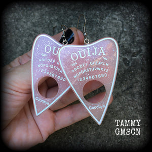 These gorgeous oversize pastel goth acrylic planchette earrings are big and dangly, weighing in at 8 grams each and measuring just under 8cms from tip to tip.

This pair have been made on stainless steel french hooks, suitable for pierced ears.