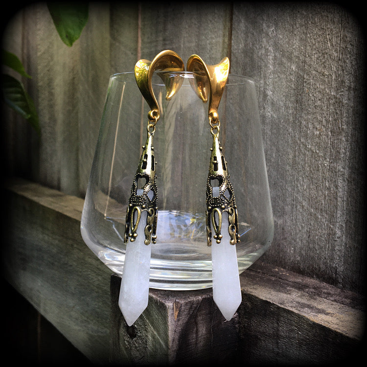 These gorgeous gothic gemstone gauged earrings feature beautiful cloudy quartz and antique bronze gemstone points, measuring just over 10 cms from tip to tip, and weighing approx 15 grams each.
These earrings have been made on 5/8" gauge (16mm) surgical steel saddles, to be worn in stretched lobes.