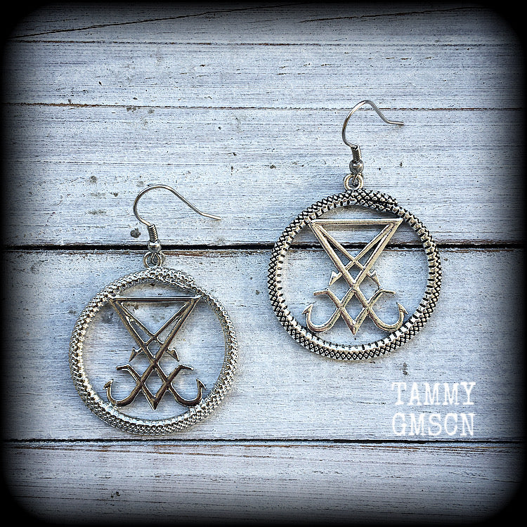 These gorgeous antique silver 'Ouroboros and Sigil of Lucifer' earrings are light weight at approx 5 grams a piece, and nice and dangly, measuring just over 5cms from tip to tip.
This pair has been made with stainless steel french hooks, suitable for pierced ears.