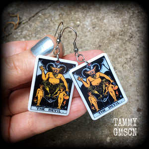 These earrings feature a lightweight Rider Waite ‘The Devil’ tarot card charm, measuring just over 6cms from tip to tip and weighing only a few grams each.

This pair has been made with stainless steel french hooks, for pierced ears.