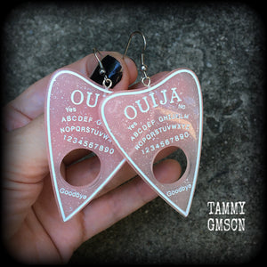 These gorgeous oversize pastel goth acrylic planchette earrings are big and dangly, weighing in at 8 grams each and measuring just under 8cms from tip to tip.

This pair have been made on stainless steel french hooks, suitable for pierced ears.