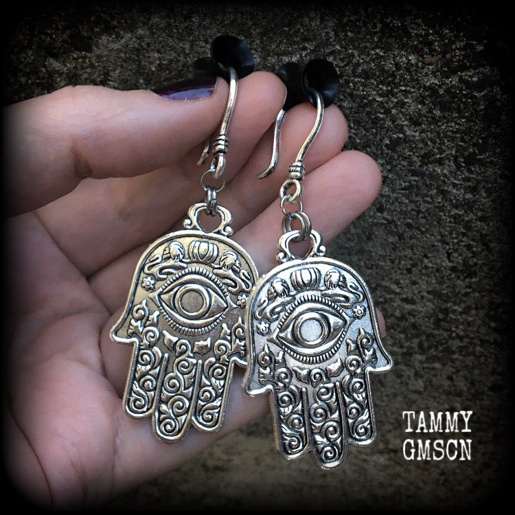 These antique silver Hamsa hand earrings weigh 10 grams each, measuring 7cms from tip to tip.
This pair has been made on small antique silver shephard hooks, suitable to be worn through stretched lobes with silicone earlets from 8 gauge (3mm).