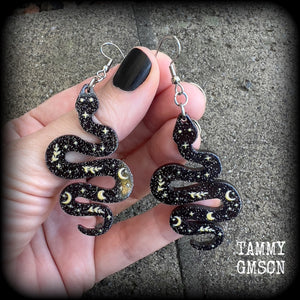 These earrings feature a beautiful black celestial patterned snake, measuring just over 7cms from tip to tip, and are super lightweight at only a few grams each.
This pair have been made with stainless steel french hooks, suitable for pierced ears.
