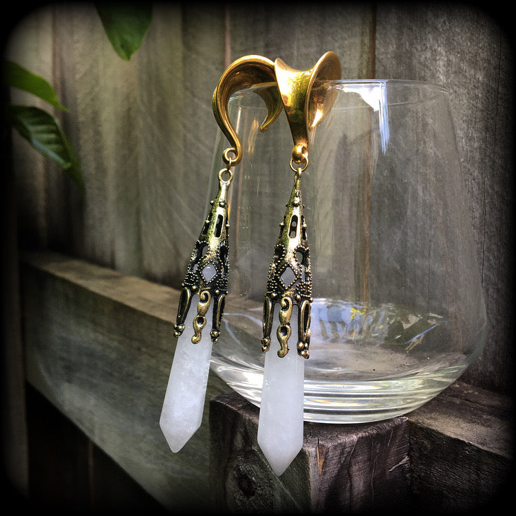 These gorgeous gothic gemstone gauged earrings feature beautiful cloudy quartz and antique bronze gemstone points, measuring just over 10 cms from tip to tip, and weighing approx 15 grams each.
These earrings have been made on 5/8" gauge (16mm) surgical steel saddles, to be worn in stretched lobes.