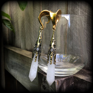 These gorgeous gothic gemstone gauged earrings feature beautiful cloudy quartz and antique bronze gemstone points, measuring just over 10 cms from tip to tip, and weighing approx 15 grams each.
These earrings have been made on 5/8" gauge (16mm) surgical steel saddles, to be worn in stretched lobes.