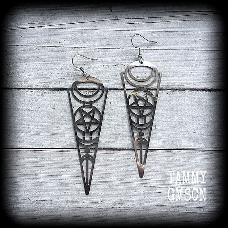 These earrings feature gorgeous esoteric crescent moon and pentagram designs, are super light weight and nice and dangly, weighing only a gram or two each, and measuring just over 9cms from tip to tip.
This pair has been made with stainless steel french hooks, to be worn through pierced ears.
