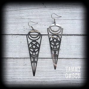 These earrings feature gorgeous esoteric crescent moon and pentagram designs, are super light weight and nice and dangly, weighing only a gram or two each, and measuring just over 9cms from tip to tip.
This pair has been made with stainless steel french hooks, to be worn through pierced ears.