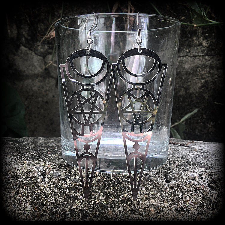These earrings feature gorgeous esoteric crescent moon and pentagram designs, are super light weight and nice and dangly, weighing only a gram or two each, and measuring just over 9cms from tip to tip.
This pair has been made with stainless steel french hooks, to be worn through pierced ears.
