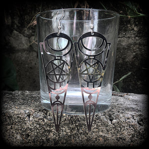 These earrings feature gorgeous esoteric crescent moon and pentagram designs, are super light weight and nice and dangly, weighing only a gram or two each, and measuring just over 9cms from tip to tip.
This pair has been made with stainless steel french hooks, to be worn through pierced ears.