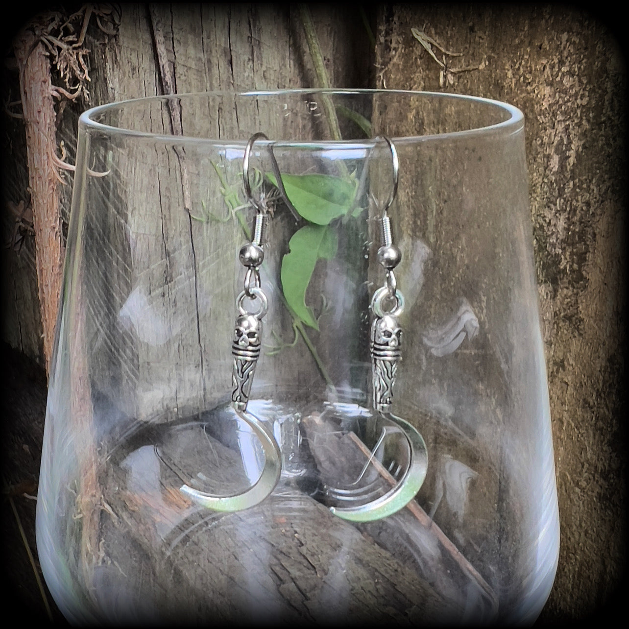 Featuring super cute super lightweight antique silver grim reaper scythes, these earrings are lovely and petite, measuring just under 5cms from tip to tip and weigh only a gram or two each.

This pair has been made with stainless steel french hooks, for pierced ears.