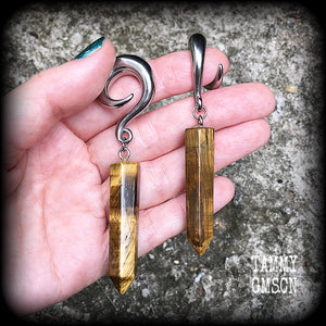 These gauged earrings are made with gorgeous Tigers eye points, measuring just over 9cms from tip to tip, and weighing approx 25grams each.
This pair have been made on 0 gauge (8mm) surgical steel full curl hooks, to be worn in stretched lobes.