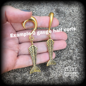 Skeletal mermaid tail gauged earrings