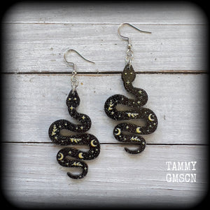 These earrings feature a beautiful black celestial patterned snake, measuring just over 7cms from tip to tip, and are super lightweight at only a few grams each.
This pair have been made with stainless steel french hooks, suitable for pierced ears.
