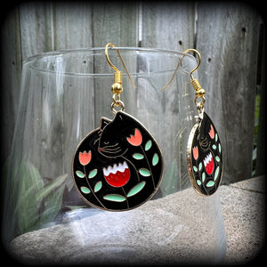 These quirky earrings and feature gorgeous folk art inspired black cat and tulip charms.
These earrings are nice and lightweight at only 4 grams, and measure just on 5cms from tip to tip.
This pair has been made with antique gold french hooks, to be worn in pierced ears.