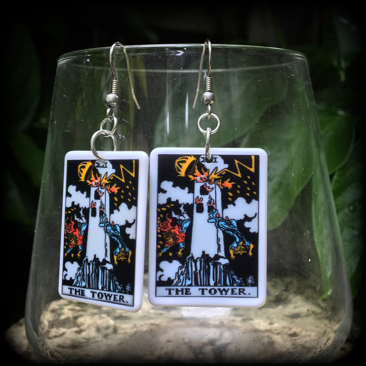 This pair of earrings features a classic Rider Waite ‘The Tower’ acrylic tarot card, measuring just over 6cms from tip to tip, and weighing only a gram or two each.

This pair has been made with stainless steel french hooks, for pierced ears.