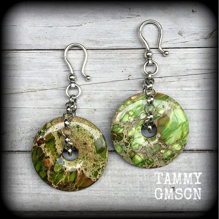 Featuring lime green ocean jasper donut gemstones, these earrings weigh in at approx 35 grams a piece, and hang just on 10cms from tip to tip.
This pair has been made with large antique silver shephard hooks, for stretched ears.