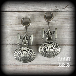 These awesome Star Trek USS Enterprise ear hangers feature a gorgeous big pewter Enterprise pendant, measuring just over 9cms from tip to tip, and weighing approx 37 grams each, nice and heavy.

This pair has been made on 5/8" gauge (16mm) surgical steel cradles, to be worn in stretched lobes.
