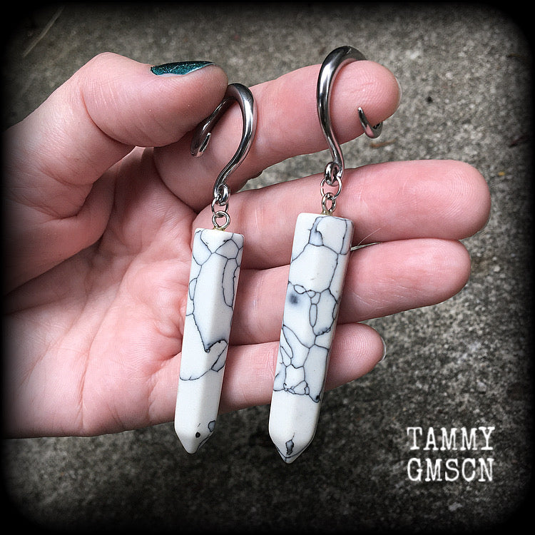 These earrings are made with beautiful white howlite stone points, measuring just on 8cms from tip to tip, and weighing approx 13grams each.
This pair has been made on 6 gauge (4mm) surgical steel full curl hooks, to be worn in stretched lobes.