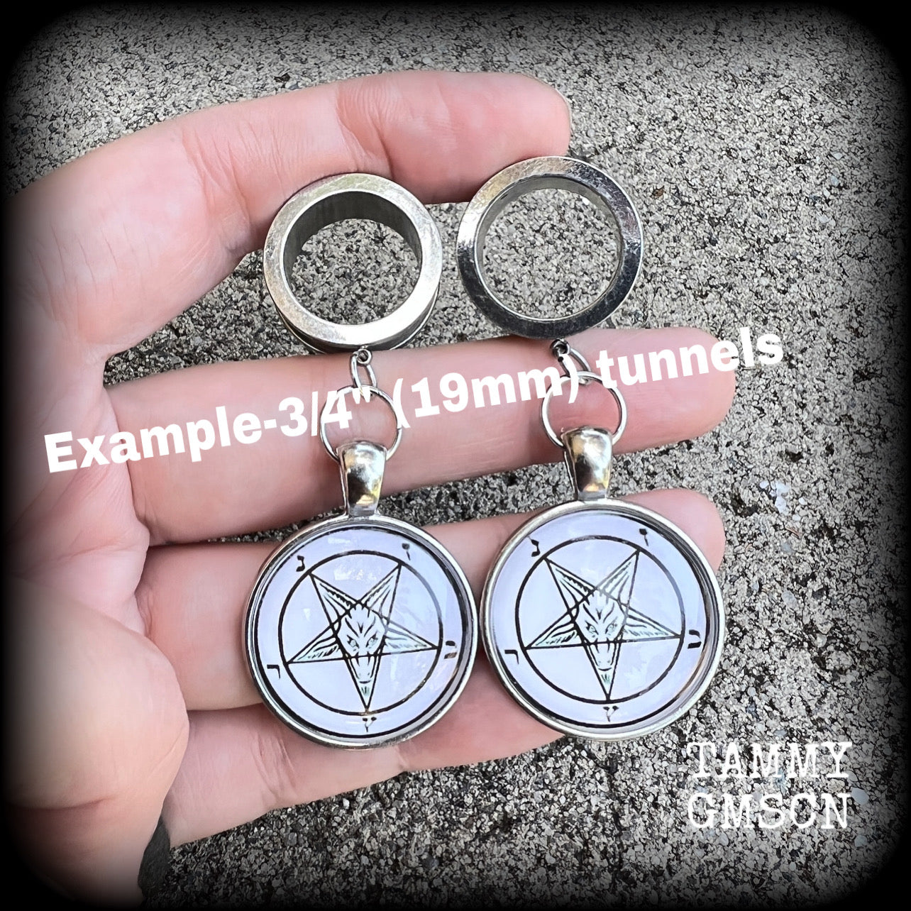 These gorgeous tunnel earrings feature classic black Sigil of Baphomet symbols on white background enclosed in resin, weighing in at approx 15 grams each and measuring just over 7 cms from tip to tip.

This pair have been made with 3/4" gauge (19mm) surgical steel screw fit tunnels, suitable for stretched lobes.