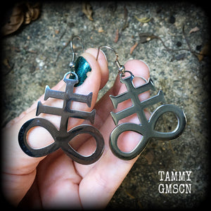 These gorgeous earrings feature large stainless steel Sigil of Sulphur pendants, measure just under 6 cms from tip to tip, and weigh approx 6 grams each.

This pair have been made with stainless steel french hooks, for pierced ears.