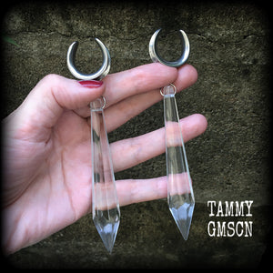 These gorgeous dangly glass earrings have been made with gorgeous faceted clear glass spears, measuring 13 cms from tip to tip, and weighing approx 13 grams each.

These earrings have been made on 3/4" gauge (19mm) surgical steel cradles, to be worn in stretched lobes.