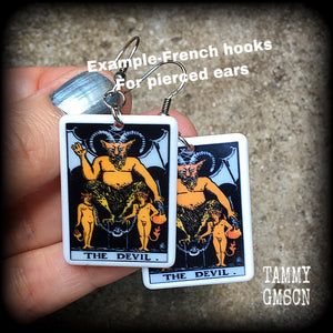 These earrings feature a lightweight Rider Waite ‘The Devil’ tarot card charm, measuring just over 6cms from tip to tip and weighing only a few grams each.

This pair has been made with stainless steel french hooks, for pierced ears.