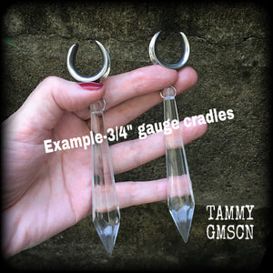 These gorgeous dangly glass earrings have been made with gorgeous faceted clear glass spears, measuring 13 cms from tip to tip, and weighing approx 13 grams each.

These earrings have been made on 3/4" gauge (19mm) surgical steel cradles, to be worn in stretched lobes.