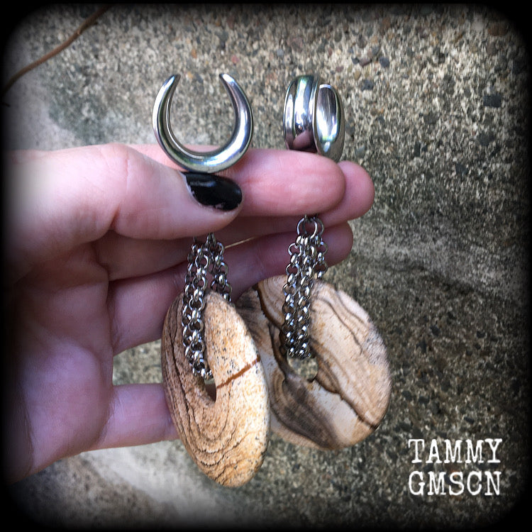 Featuring a pair of gorgeous streaky picture jasper donut gemstones cradled in sturdy stainless steel chain links, these gauged earrings weigh approx 32 grams a piece and measure just under 10cms from tip to tip.

This pair have been made on 3/4" gauge (19mm) surgical steel cradles, suitable for stretched lobes.