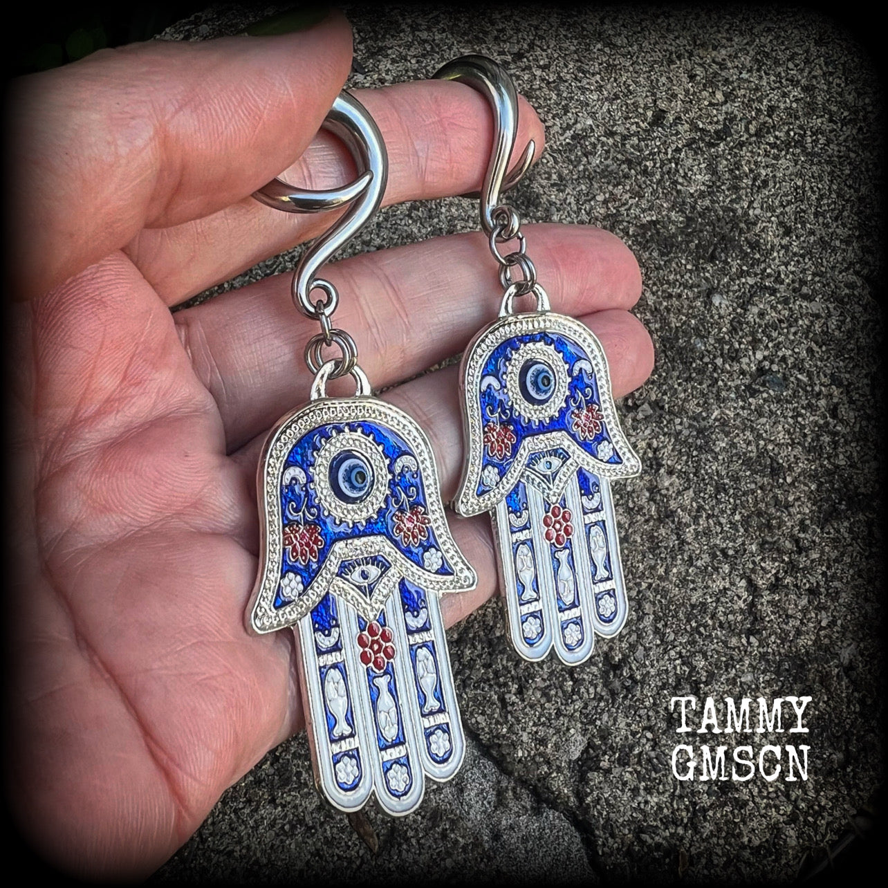 These gorgeous antique silver and enamel hamsa hand gauged earrings weigh approx 17 grams each, and measure just on 9cms from tip to tip, nice and dangly.

This pair have been made on 2 gauge (6mm) surgical steel full curl hooks, to be worn in stretched lobes.